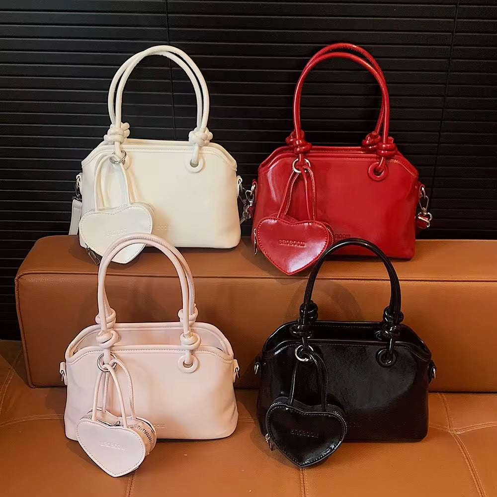 Elegant Handbags with heart charm coin purse in White, Red, Pink, and Black - Perfect for Any Occasion