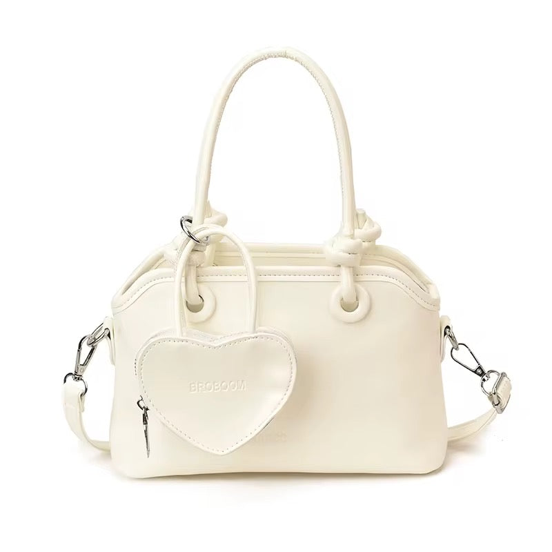 Elegant Handbags with heart charm coin purse in White, Red, Pink, and Black - Perfect for Any Occasion