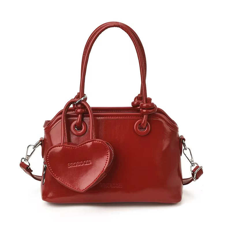 Elegant Handbags with heart charm coin purse in White, Red, Pink, and Black - Perfect for Any Occasion