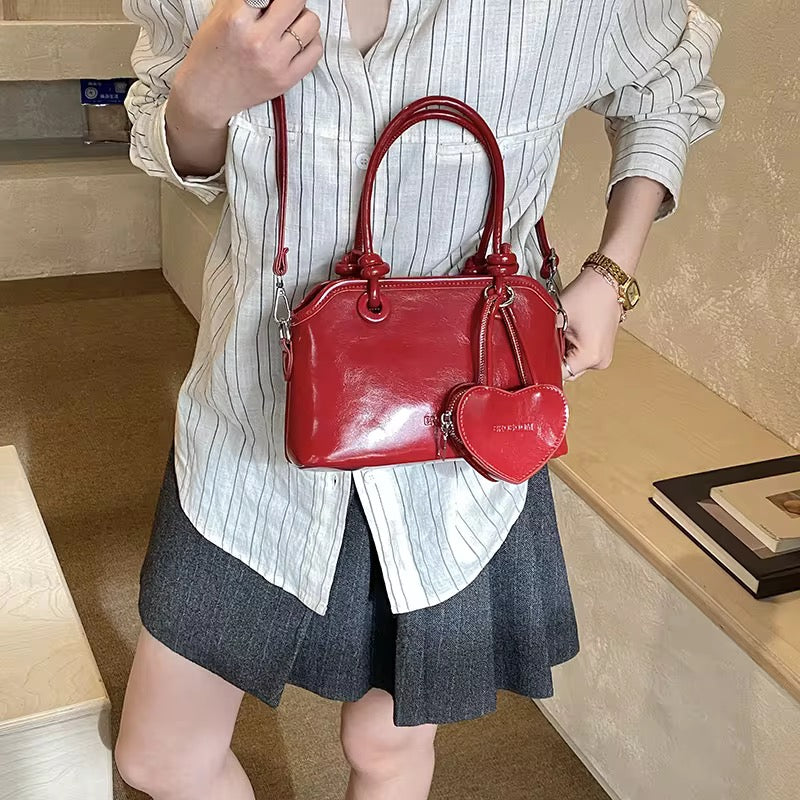 Elegant Handbags with heart charm coin purse in White, Red, Pink, and Black - Perfect for Any Occasion