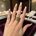 Stacked statement ring with green stones