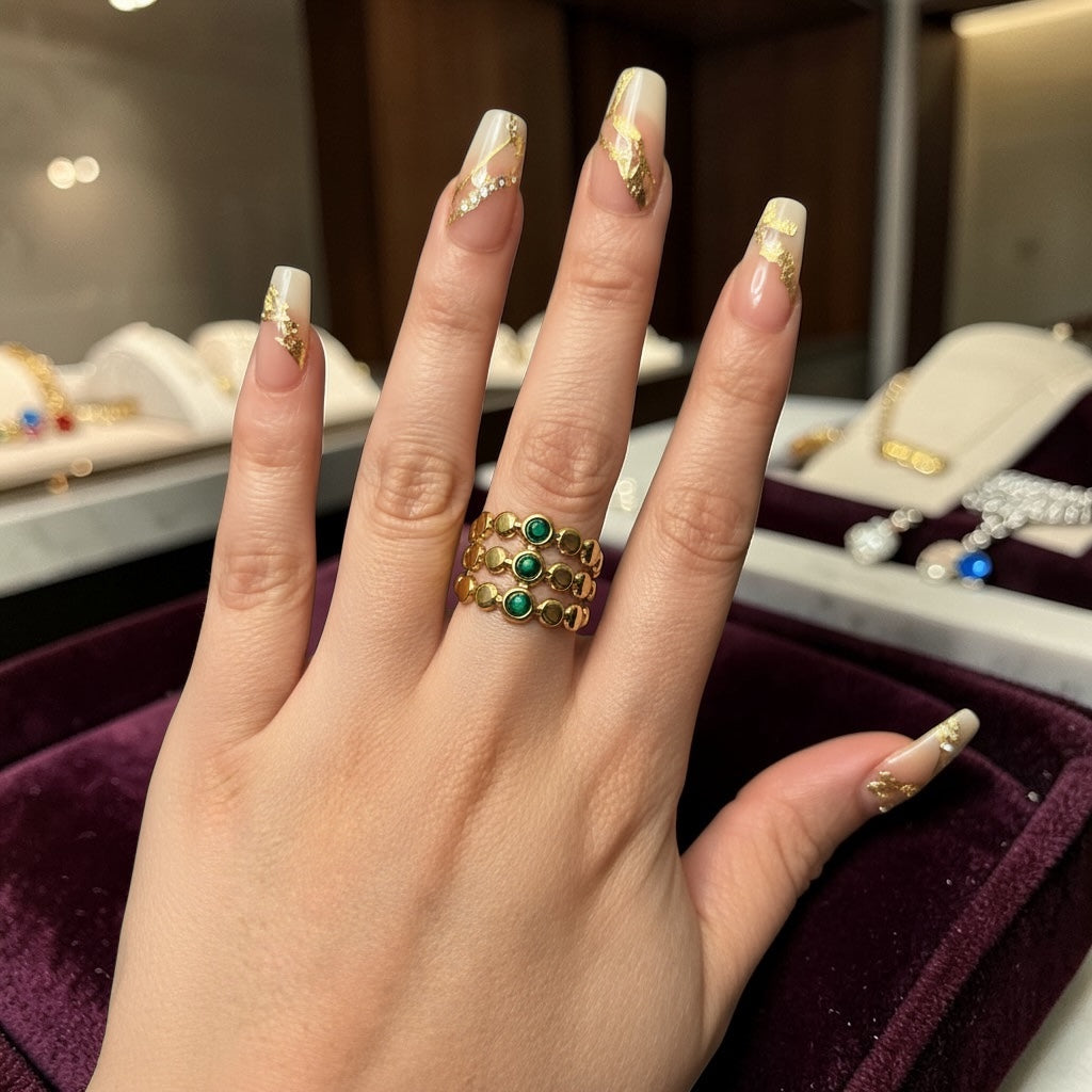 Stacked statement ring with green stones